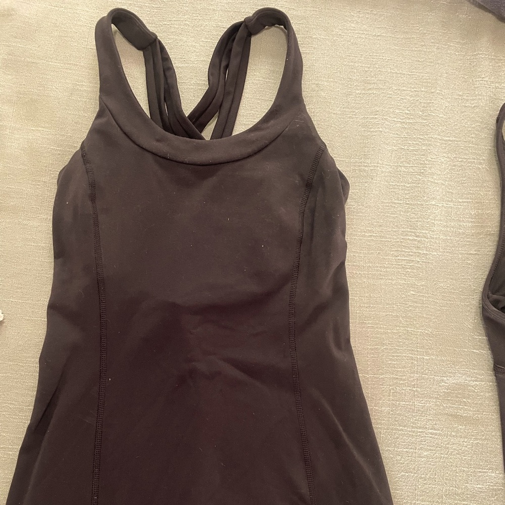 Lululemon sport top, size 6, black in color. There are no pads in this